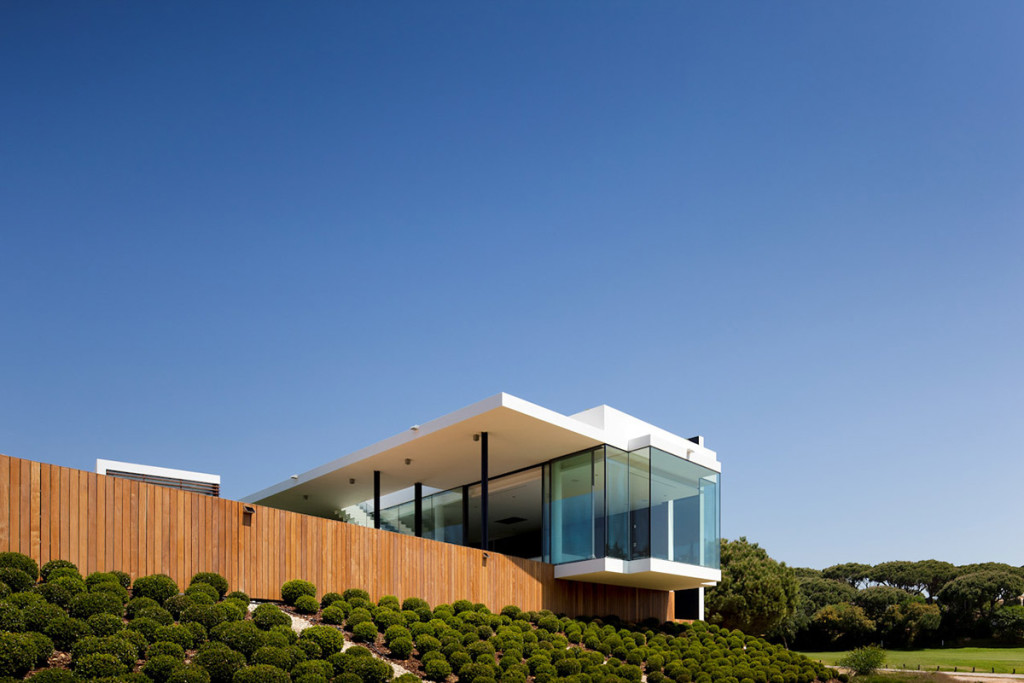 Modern-Home-Suspended-Pool-Portugal-Glass-Walls-Garden
